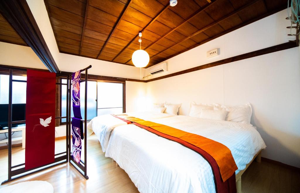 A bed or beds in a room at Awaji Seaside Hotel in Ikuho