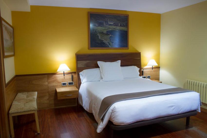 Postel nebo postele na pokoji v ubytování Hotel Vall de Núria