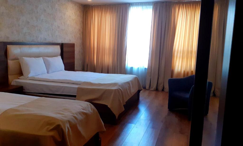 Postel nebo postele na pokoji v ubytování Hotel Lile