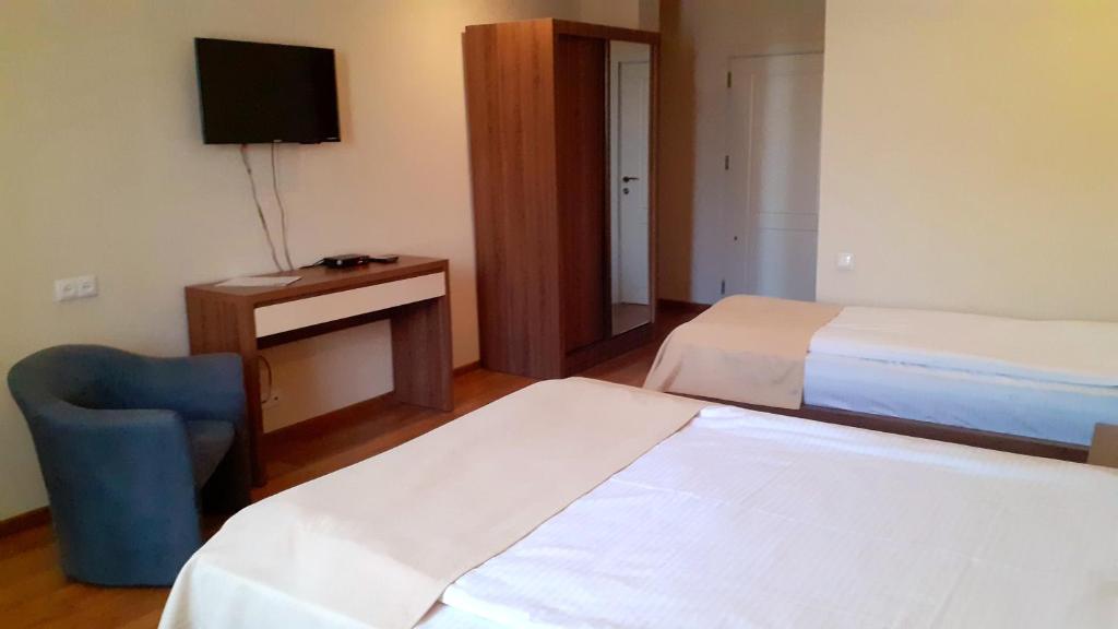 Postel nebo postele na pokoji v ubytování Hotel Lile