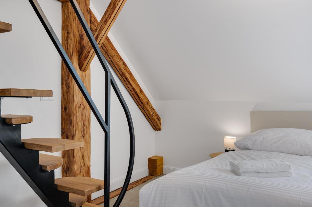 Posteľ alebo postele v izbe v ubytovaní Palace Apartments