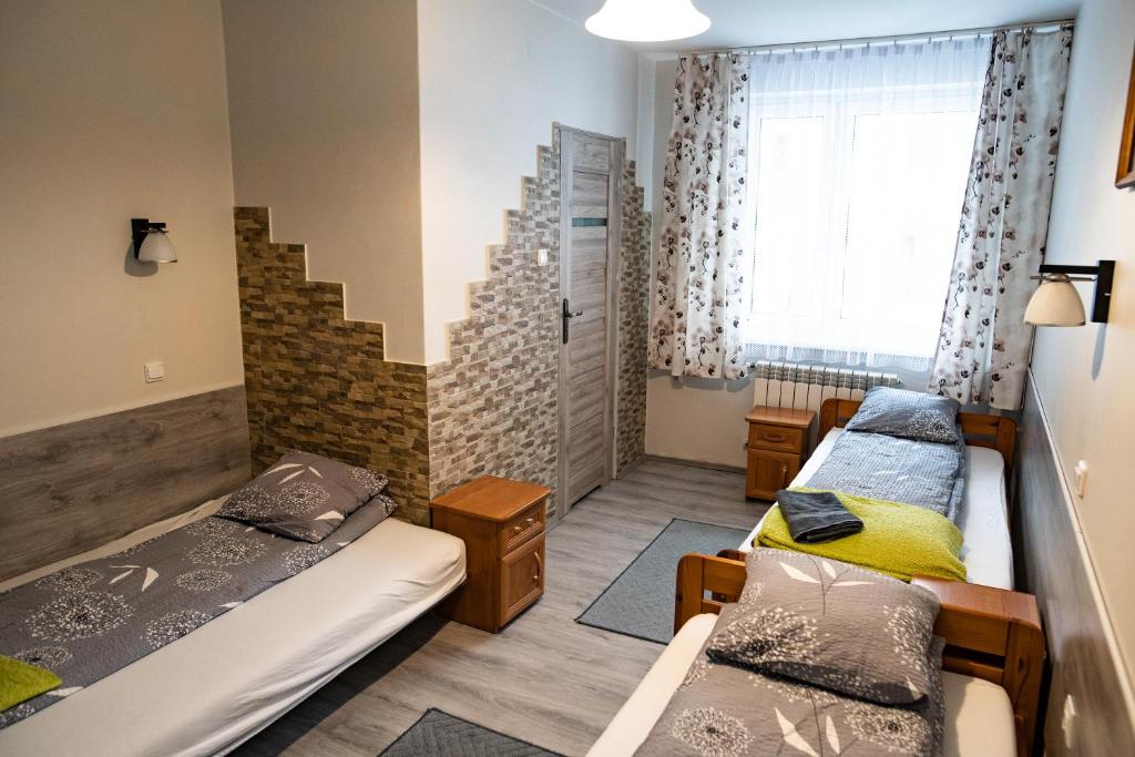 Posteľ alebo postele v izbe v ubytovaní Trojanda