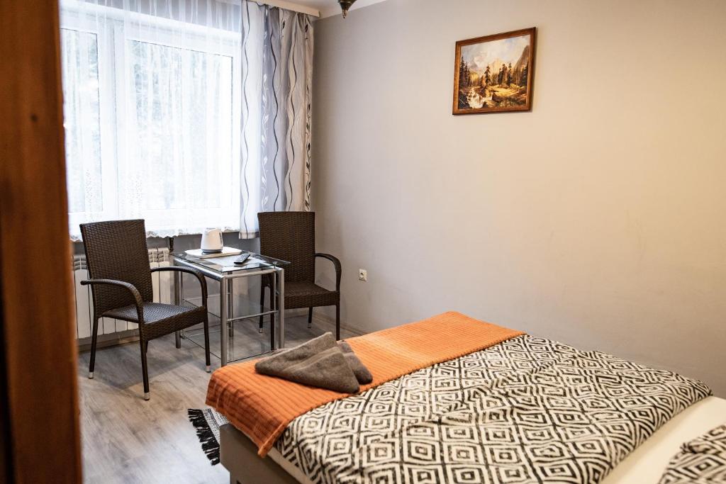 Posteľ alebo postele v izbe v ubytovaní Trojanda