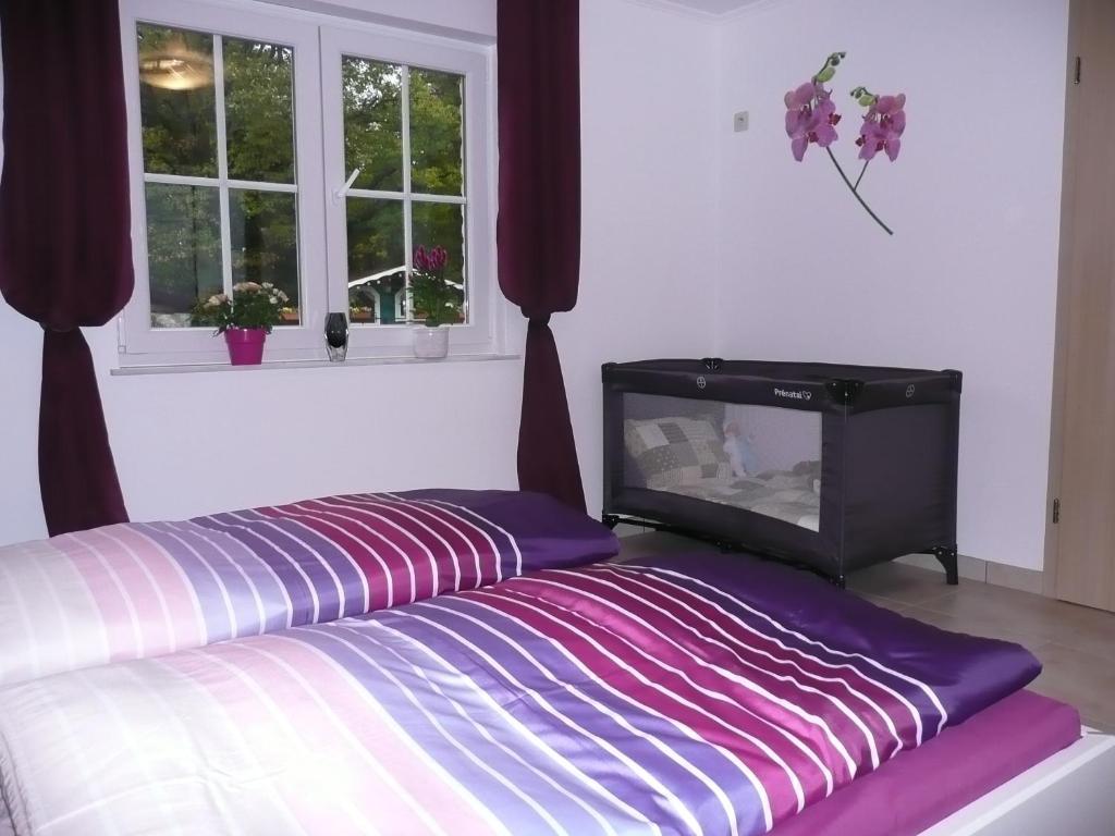 Postel nebo postele na pokoji v ubytování Ferienwohnung "Sweet Home"