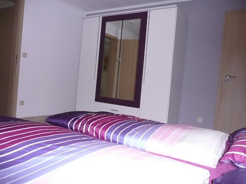 Postel nebo postele na pokoji v ubytování Ferienwohnung "Sweet Home"