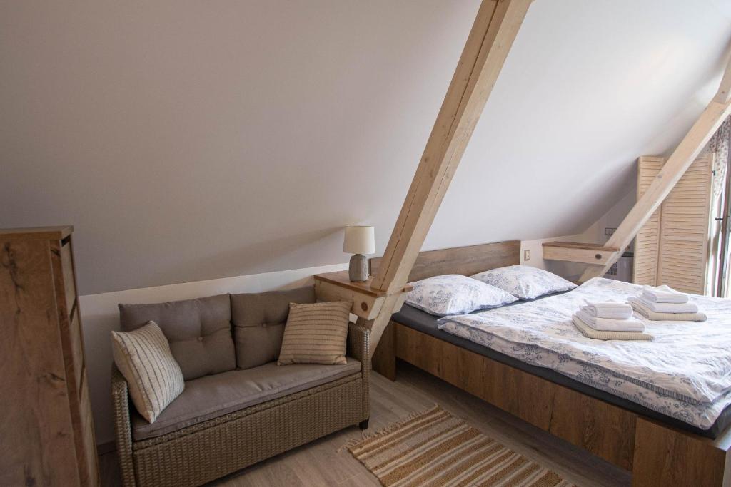 Postel nebo postele na pokoji v ubytování Apartmány NA DAŘILCE