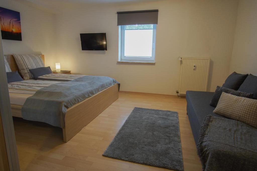 Postel nebo postele na pokoji v ubytování Komfort-Apart Paula