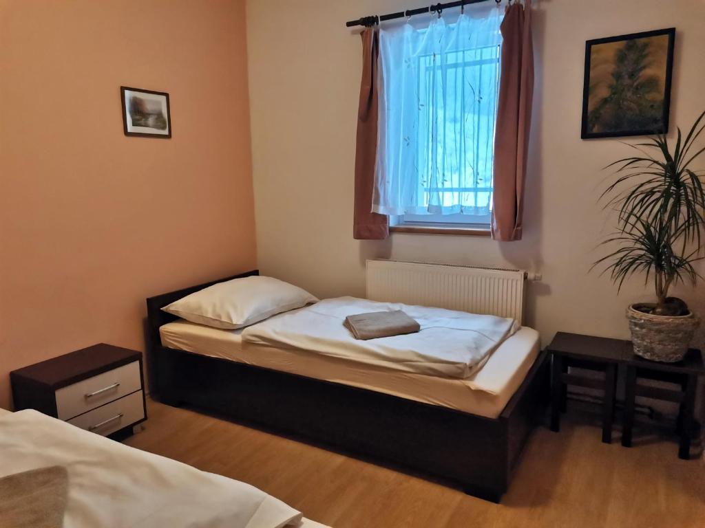 Postel nebo postele na pokoji v ubytování Sedlonov 178