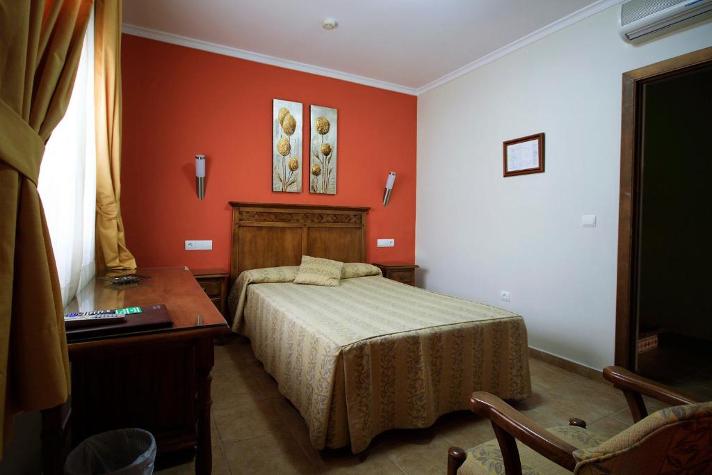Postel nebo postele na pokoji v ubytování Hostal Costa Luz
