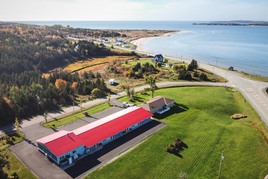 an aerial view of a train station next to the ocean at Hebridean Motel in Port Hood