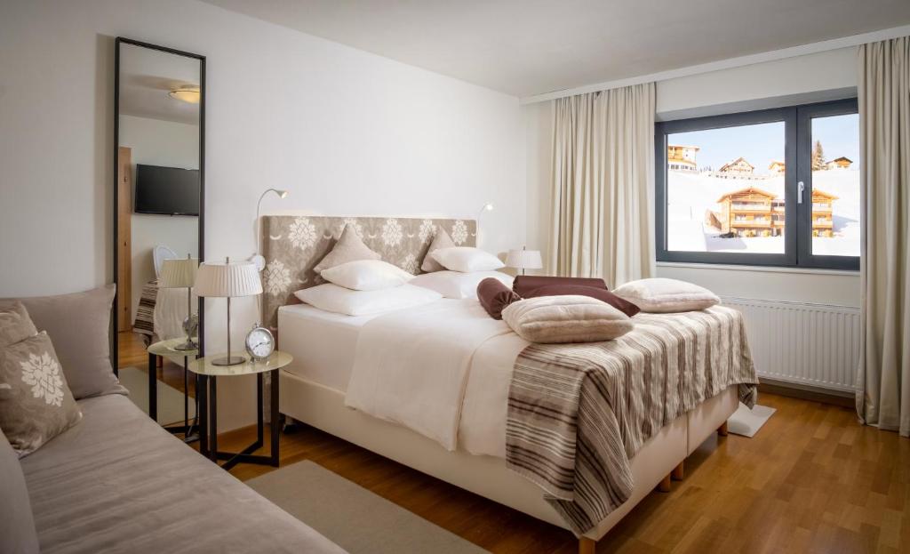 Voodi või voodid majutusasutuse Hotel Bergkristall Oberlech toas