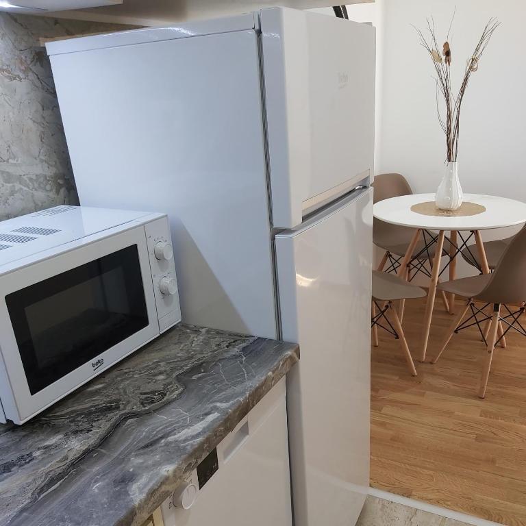 Kuchyň nebo kuchyňský kout v ubytování Apartman Miss T
