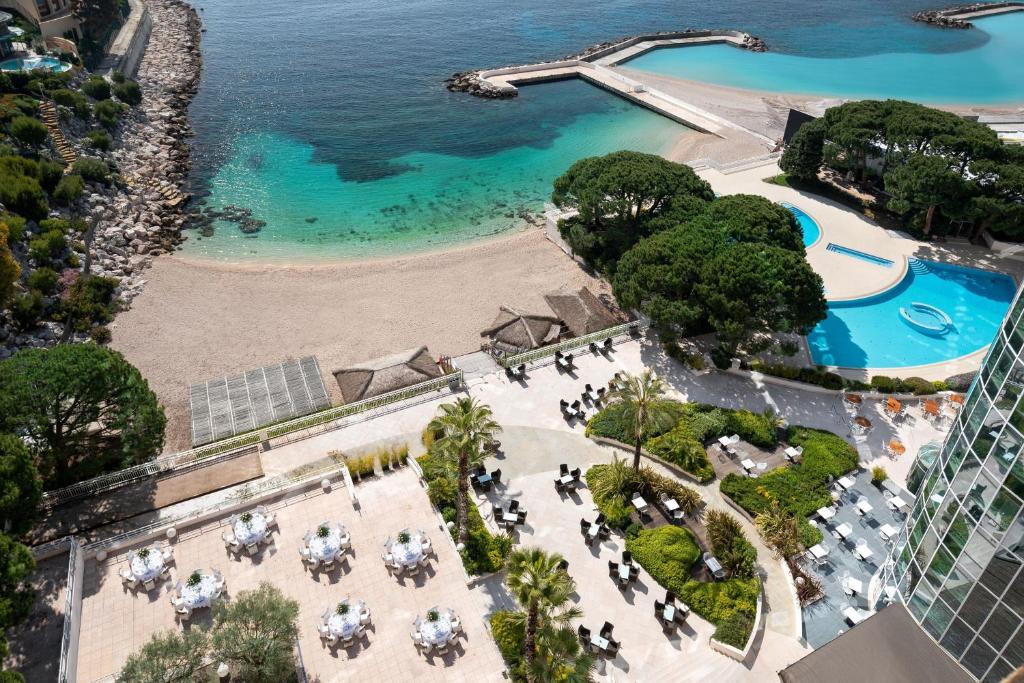 an aerial view of a resort with a beach and a pool at Le Méridien Beach Plaza in Monte Carlo