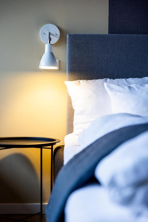 Postel nebo postele na pokoji v ubytování Hotel Sønderborg Kaserne