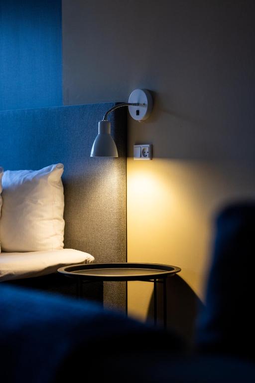 Postel nebo postele na pokoji v ubytování Hotel Sønderborg Kaserne