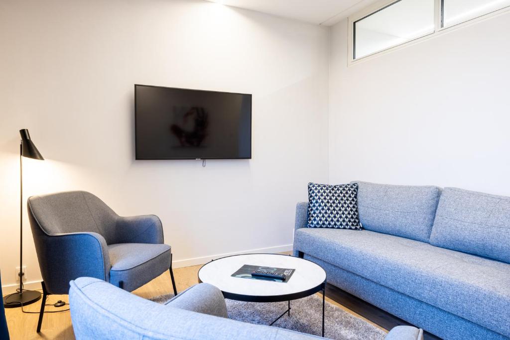 TV a/nebo společenská místnost v ubytování Hotel Sønderborg Kaserne
