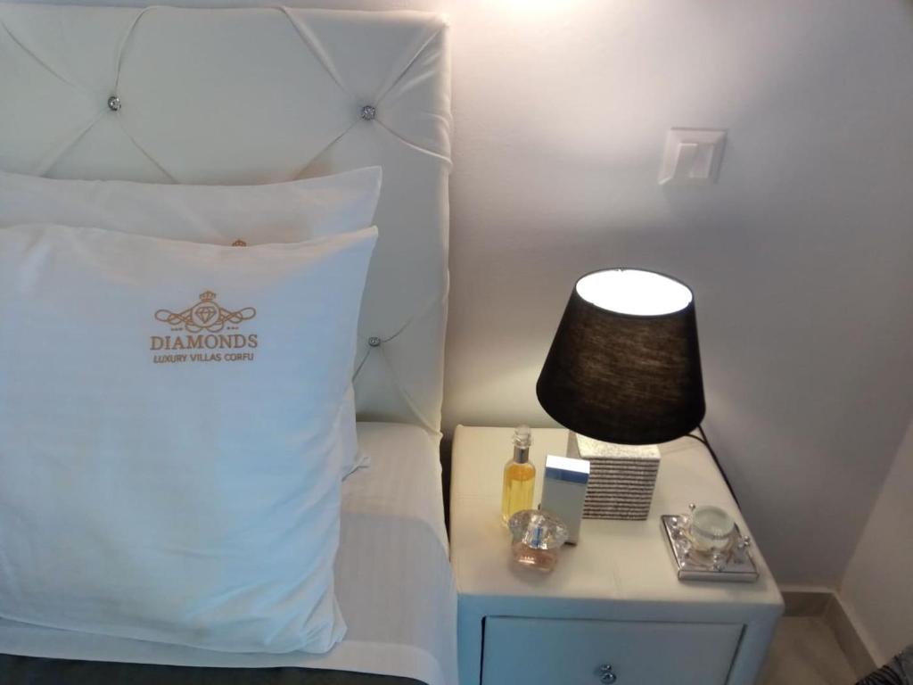 A bed or beds in a room at Diamond Luxury Villa Corfu 6 Bedroom Luxury Villa