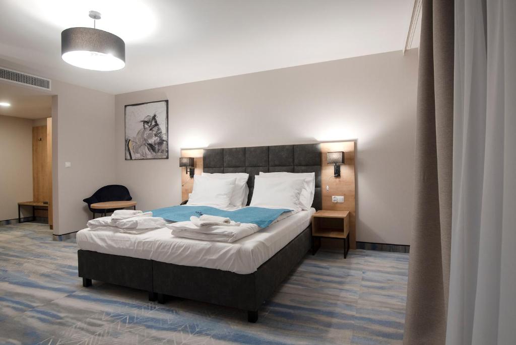 Posteľ alebo postele v izbe v ubytovaní Hotel Jarzębata