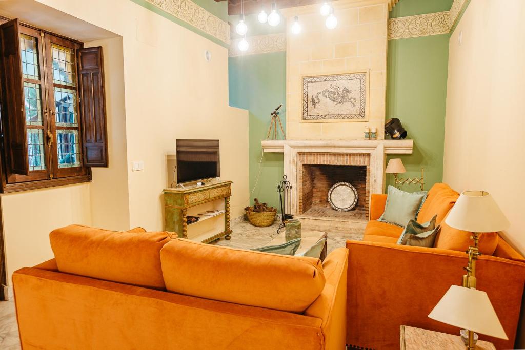 Televízia a/alebo spoločenská miestnosť v ubytovaní La casa del Cipres una casa con historia