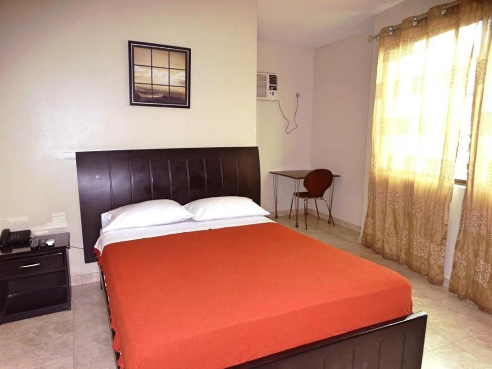 Postel nebo postele na pokoji v ubytování Hotel Marvento II
