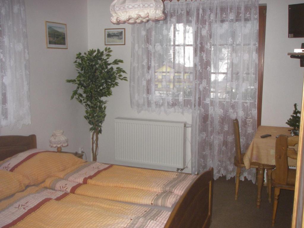 Postel nebo postele na pokoji v ubytování Pension Luscinia