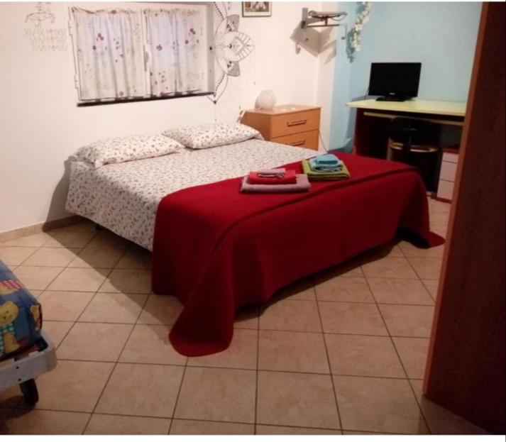 Posteľ alebo postele v izbe v ubytovaní Iris Casa Vacanze