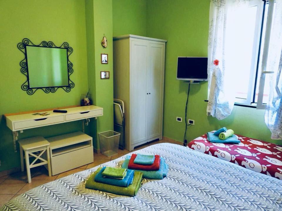 Posteľ alebo postele v izbe v ubytovaní Iris Casa Vacanze
