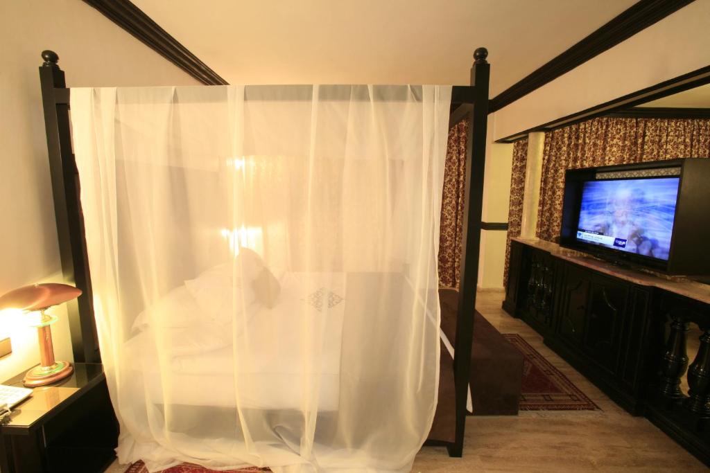 TV a/nebo společenská místnost v ubytování Imperial Holiday Hôtel & spa