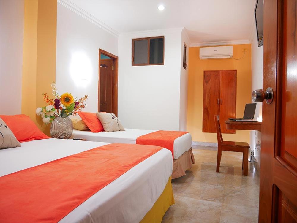 Postel nebo postele na pokoji v ubytování Hostal España