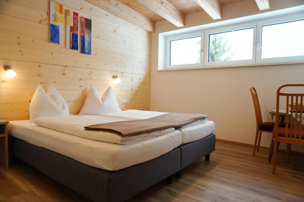 Postel nebo postele na pokoji v ubytování Zenauerhof