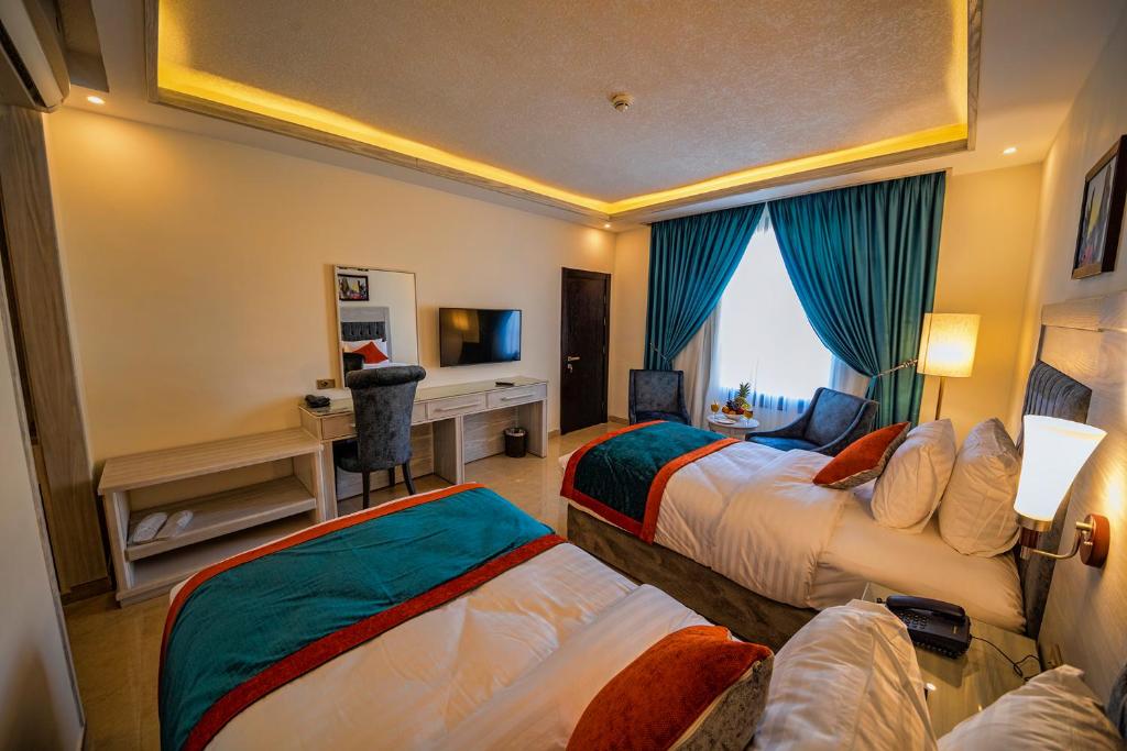 Postel nebo postele na pokoji v ubytování Petra Canyon Hotel