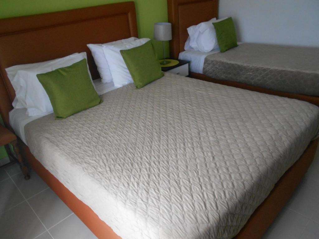 En eller flere senge i et værelse på Sol Dourado