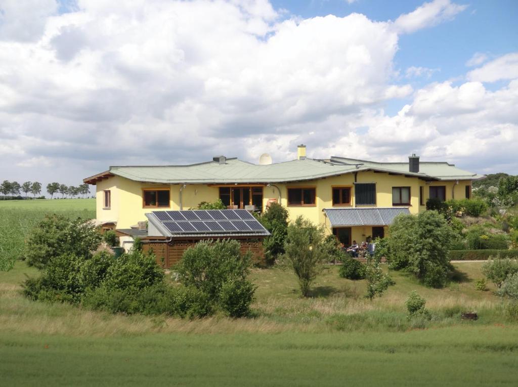 a house with solar panels on top of it at Sternhaus Nr.1 in Waren
