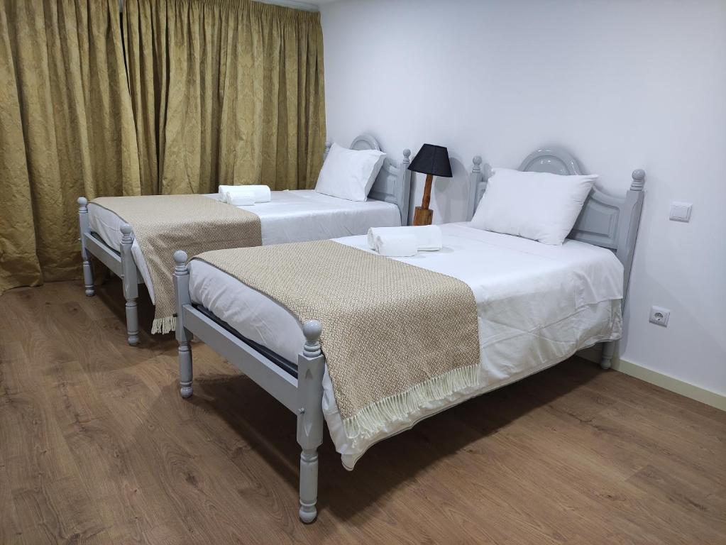 Llit o llits en una habitació de Casa do Lago da Quinta de Esteves