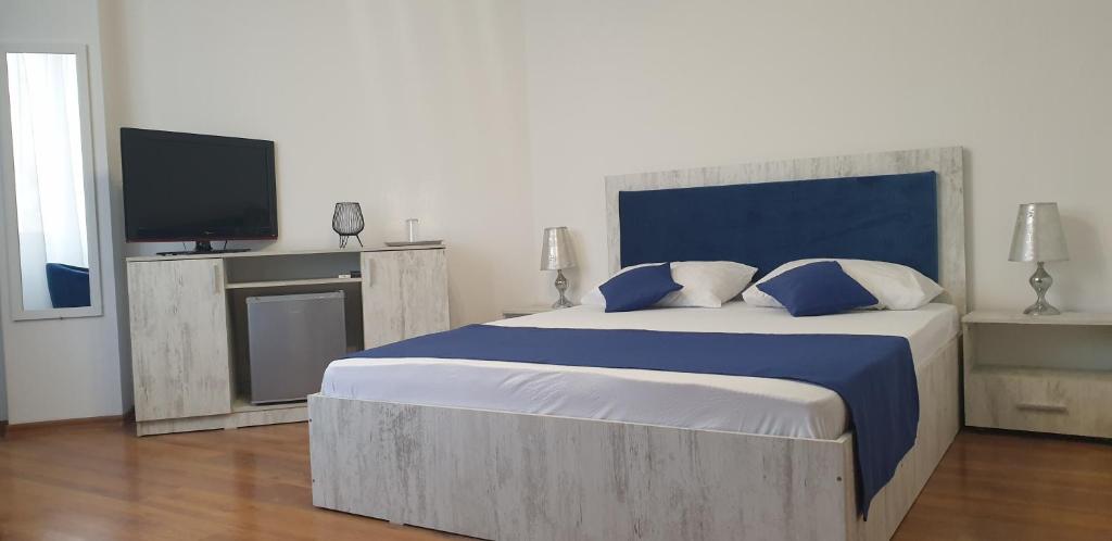 Postel nebo postele na pokoji v ubytování Hotel Allegro