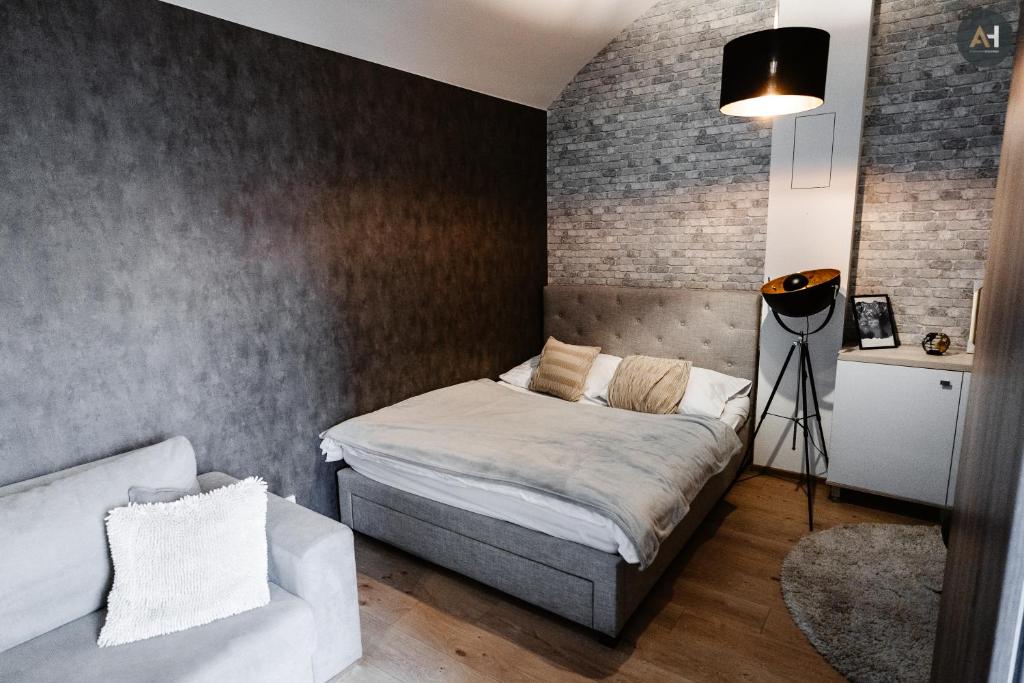 Ένα ή περισσότερα κρεβάτια σε δωμάτιο στο AH Poštová