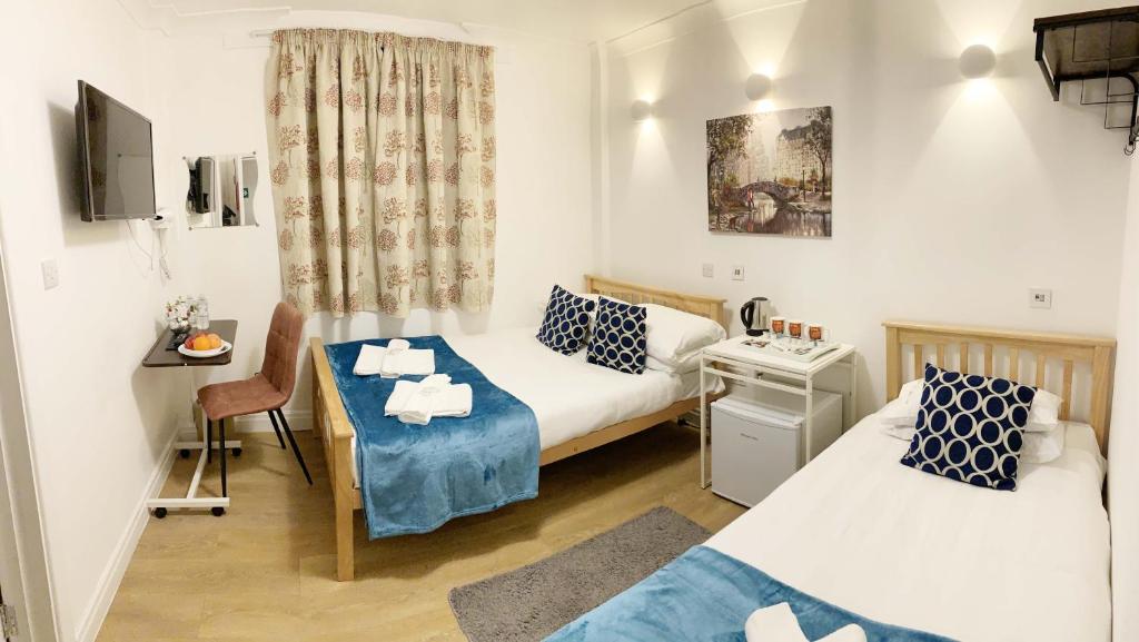 Ένα ή περισσότερα κρεβάτια σε δωμάτιο στο City London Hotel