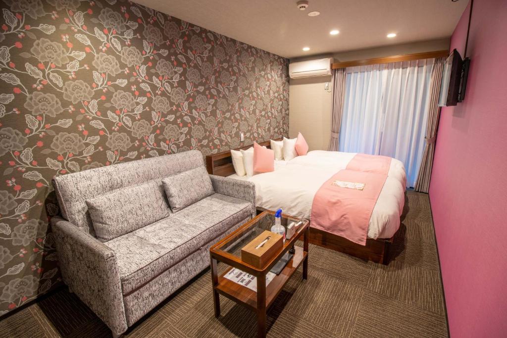 Postel nebo postele na pokoji v ubytování Stay SAKURA Kyoto Shijo Karasuma