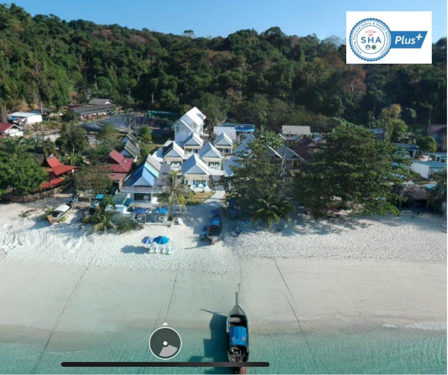 an aerial view of a house on a beach at PP Blue Sky Resort-SHA Plus in Phi Phi Islands