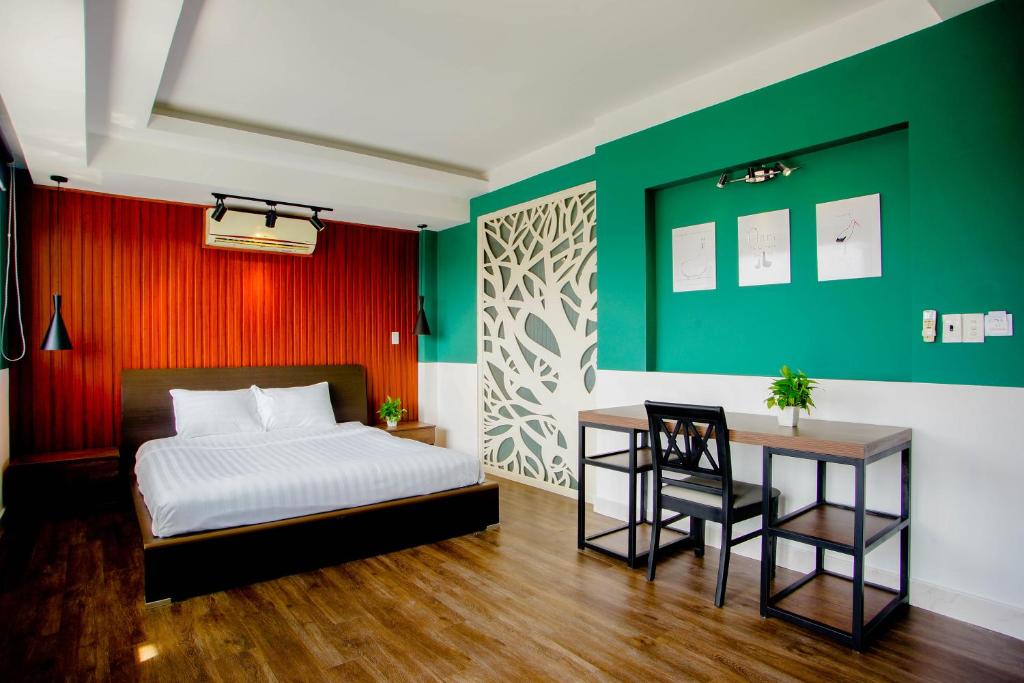 Ένα ή περισσότερα κρεβάτια σε δωμάτιο στο Lá Hotel Bình Tân
