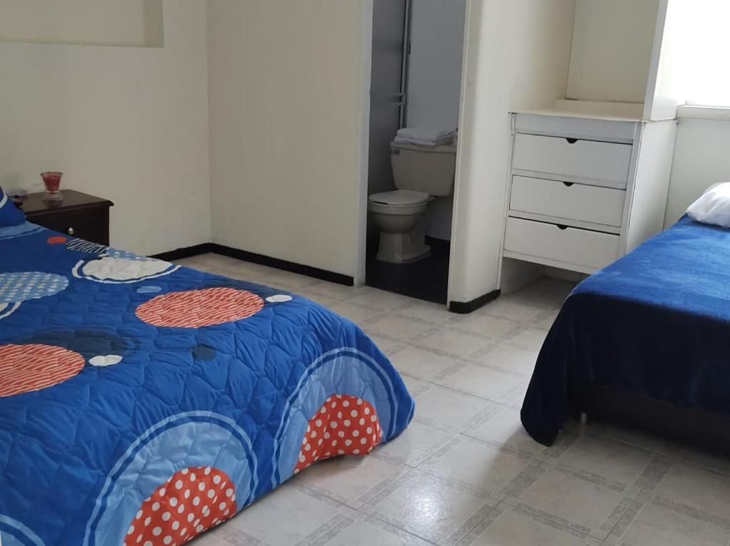 Postel nebo postele na pokoji v ubytování CASA HOTEL MODELIA REAL
