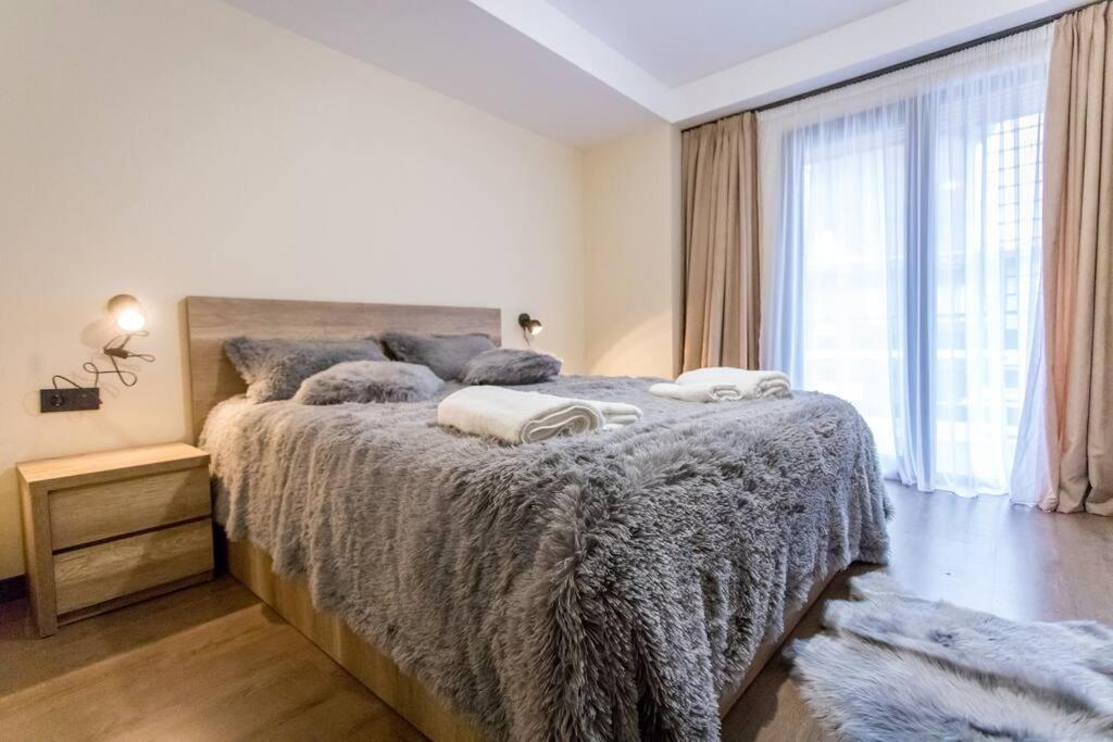 Un ou plusieurs lits dans un hébergement de l'établissement Unique Ski Resort Apartment in Gudauri