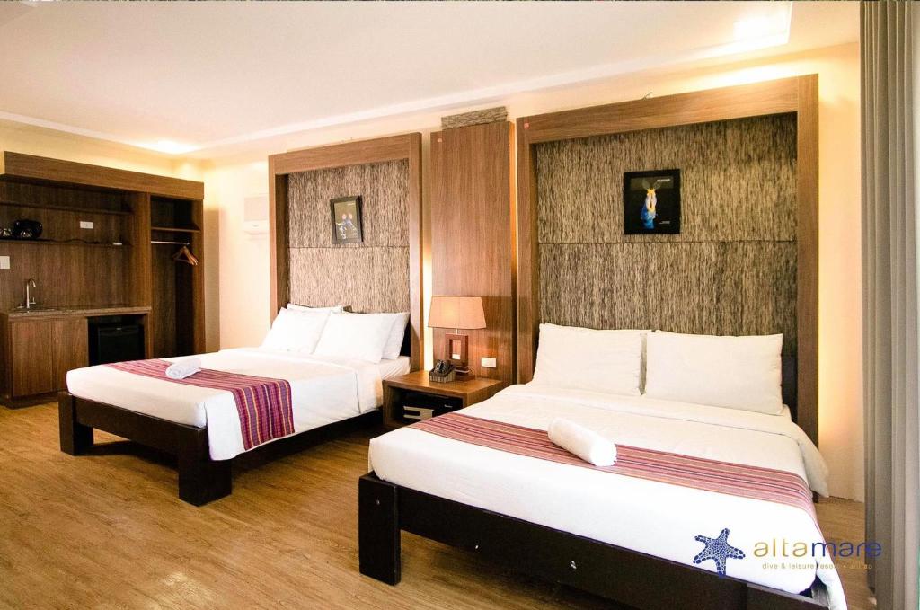 Cama o camas de una habitación en Altamare Dive and Leisure Resort Anilao
