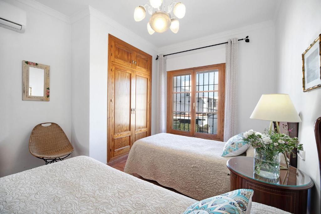 A bed or beds in a room at Caracola Apartment