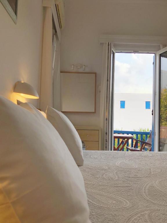 Postel nebo postele na pokoji v ubytování Matina Hotel