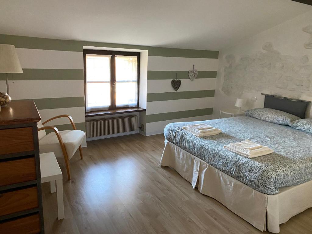 Posteľ alebo postele v izbe v ubytovaní La casa di Manu