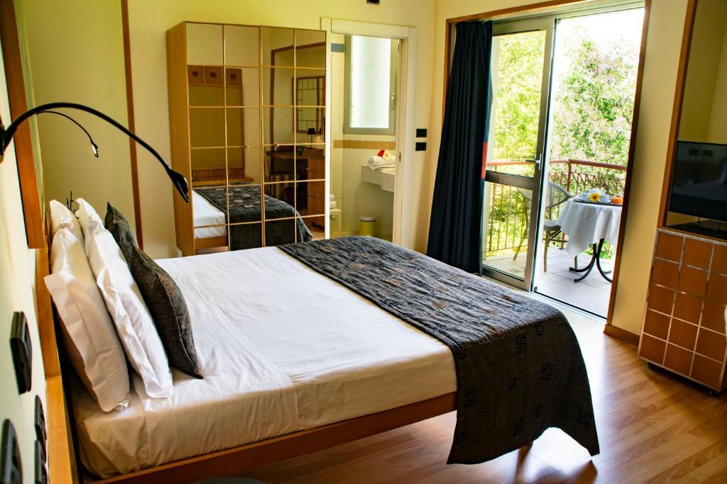 Posteľ alebo postele v izbe v ubytovaní Hotel Terme di Castel San Pietro