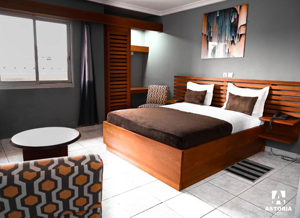 Postel nebo postele na pokoji v ubytování Hotel Astoria