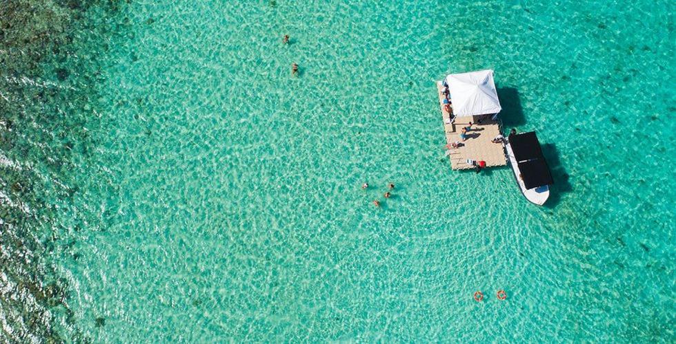 an aerial view of a boat in the water at Swiss Nest Travel in Roches Noires