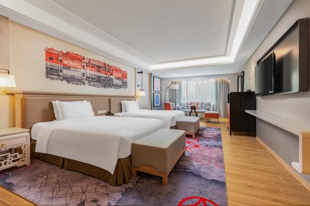 Postel nebo postele na pokoji v ubytování voco Guangzhou Shifu by IHG